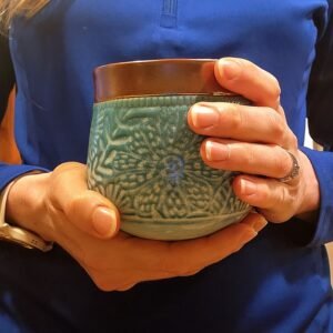 Woman holding Full Send Herbal Pre-Workout Tea by Upper Valley Herbals